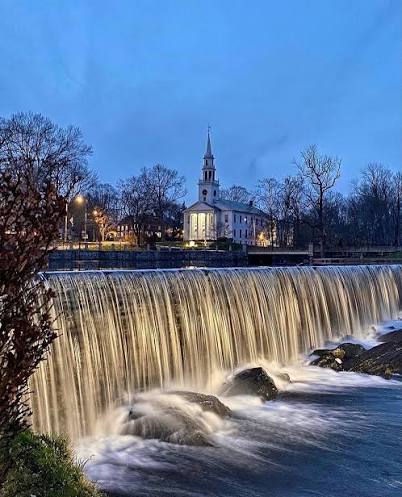 Milford waterfall and church at dusk